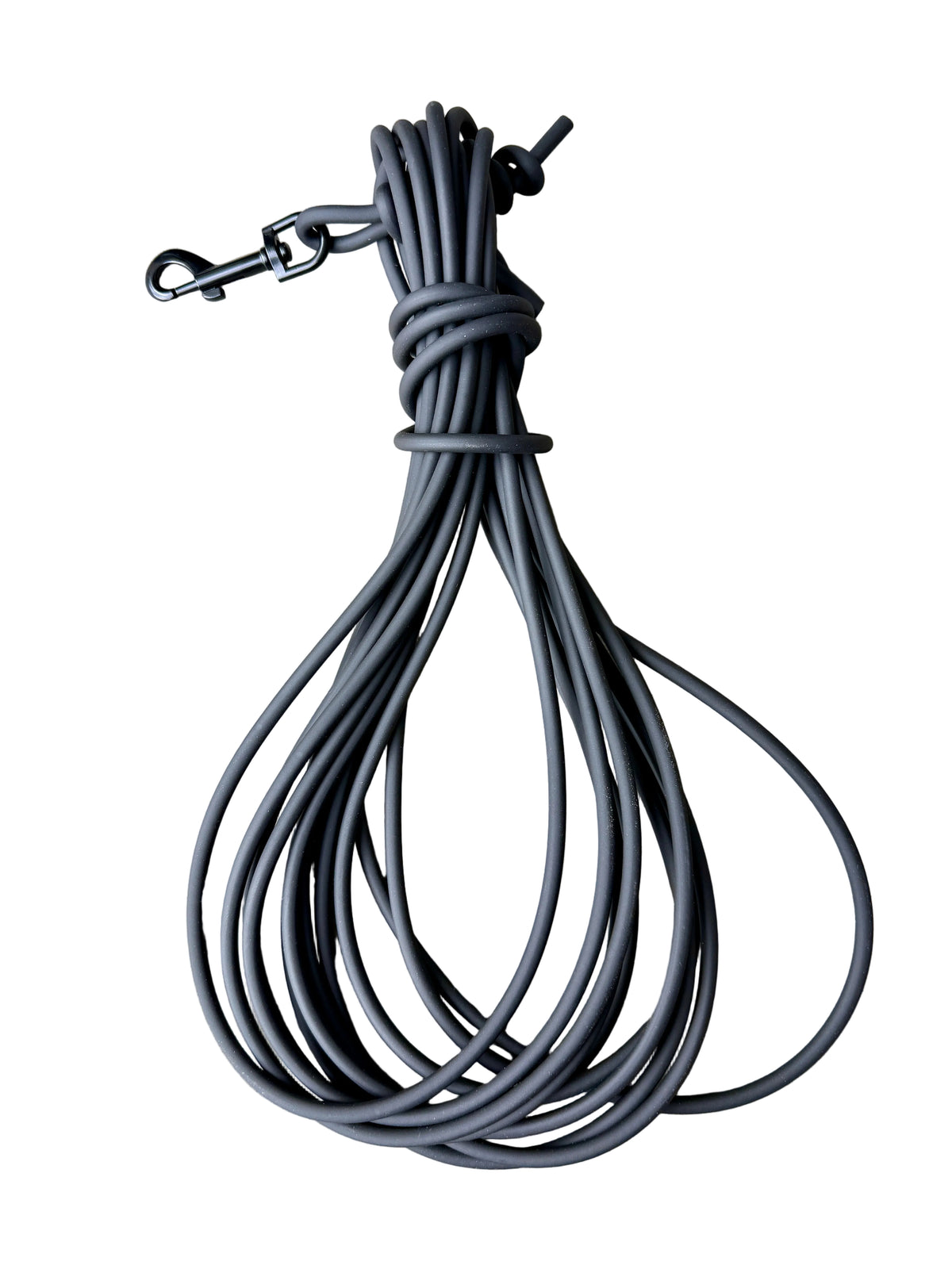 A coiled black biothane leash with a black metal snap hook attachment, 