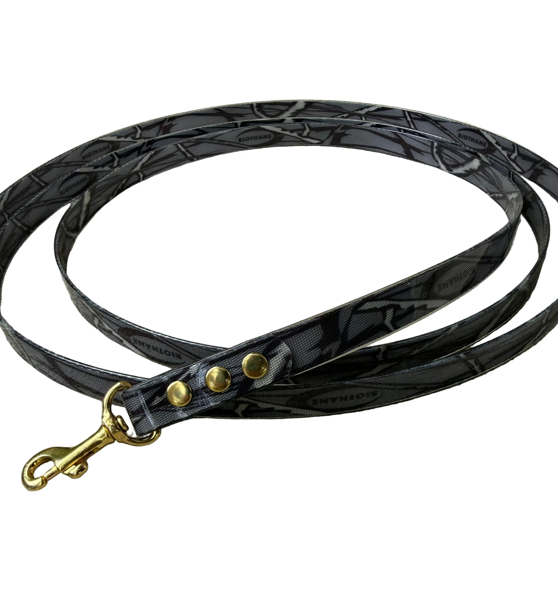 Black braided biothane dog leash with gold hardware on a white background.