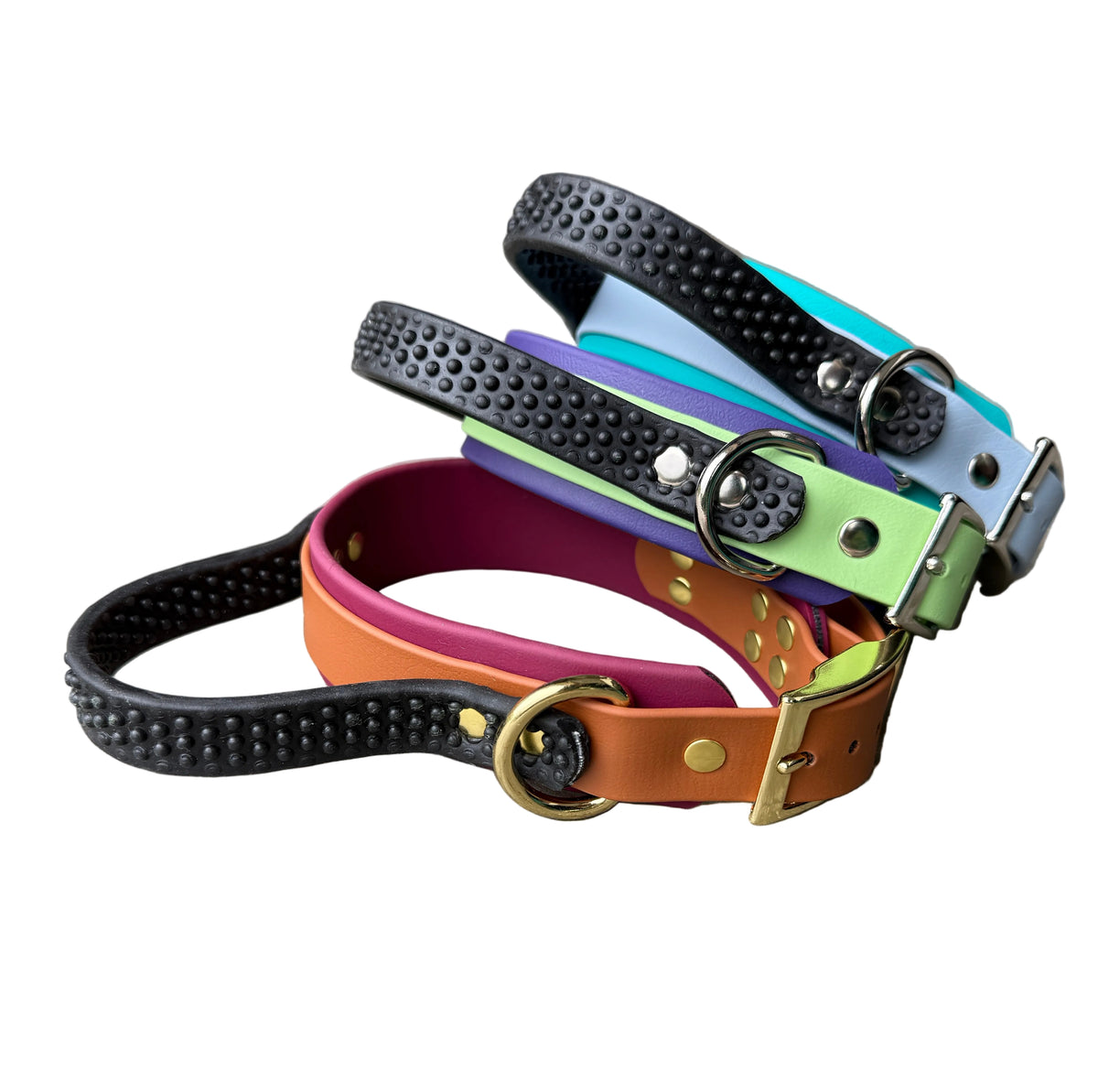 Three colorful dog collars with textured black studded straps and brass hardware, 