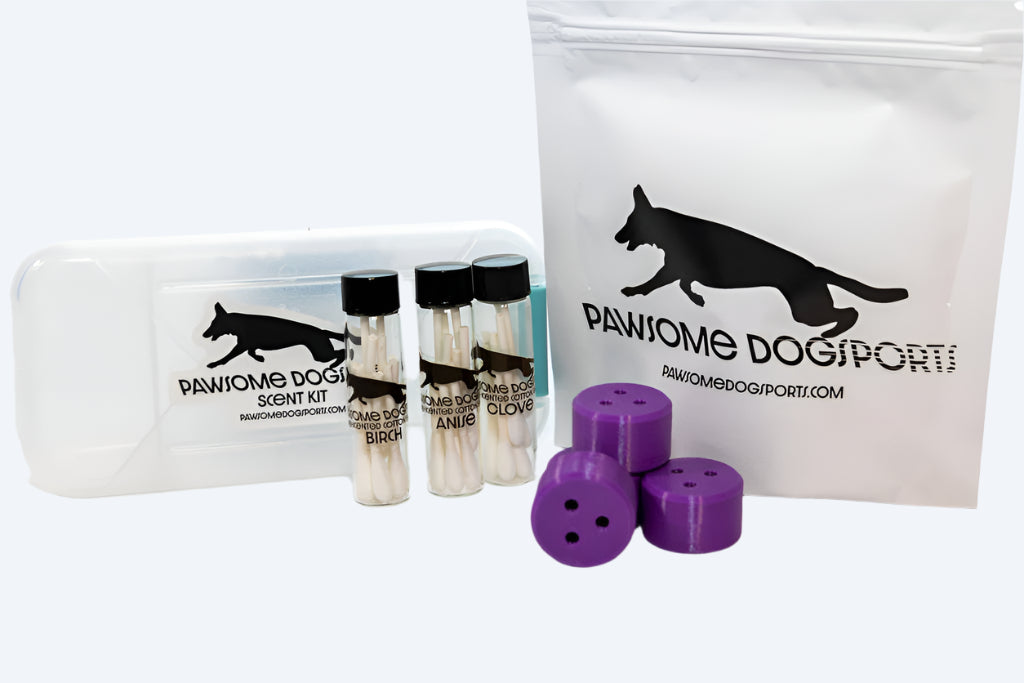 The image shows a Basic Nosework Kit which includes a white storage case with branding, purple magnetic mini-hides, and tubes with pre-cut and scented swabs.