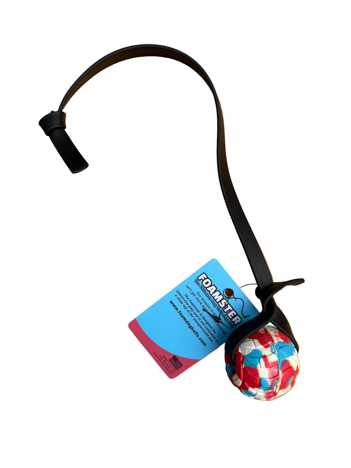 A foam ball dog toy with a black strap and a colorful red, white, and blue patterned ball with a white background. 