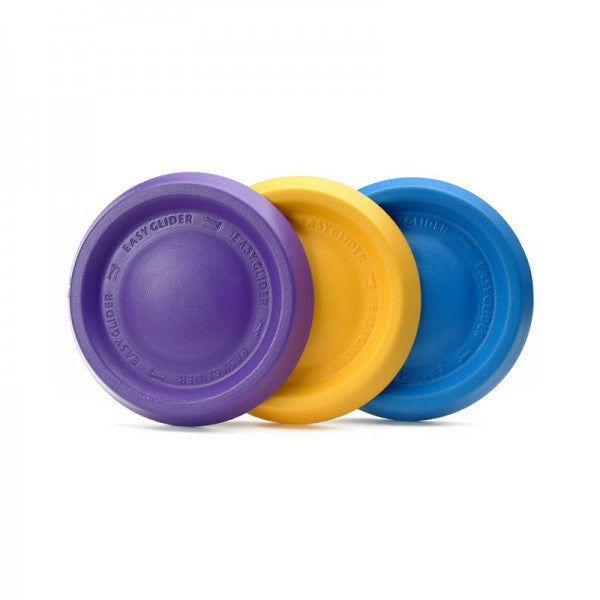 Three colorful dog toy discs in purple, yellow, and blue, arranged vertically in that order with the Starmark logo visible on the top surface of the purple disc.