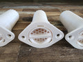 A set of white PETG scent detection tubes sitting on a wooden structure.