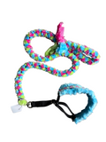 Colorful dog muzzle and leash set on a white background.