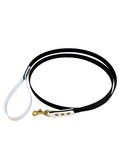 Black and white dog leash with a brass clasp on a white background.