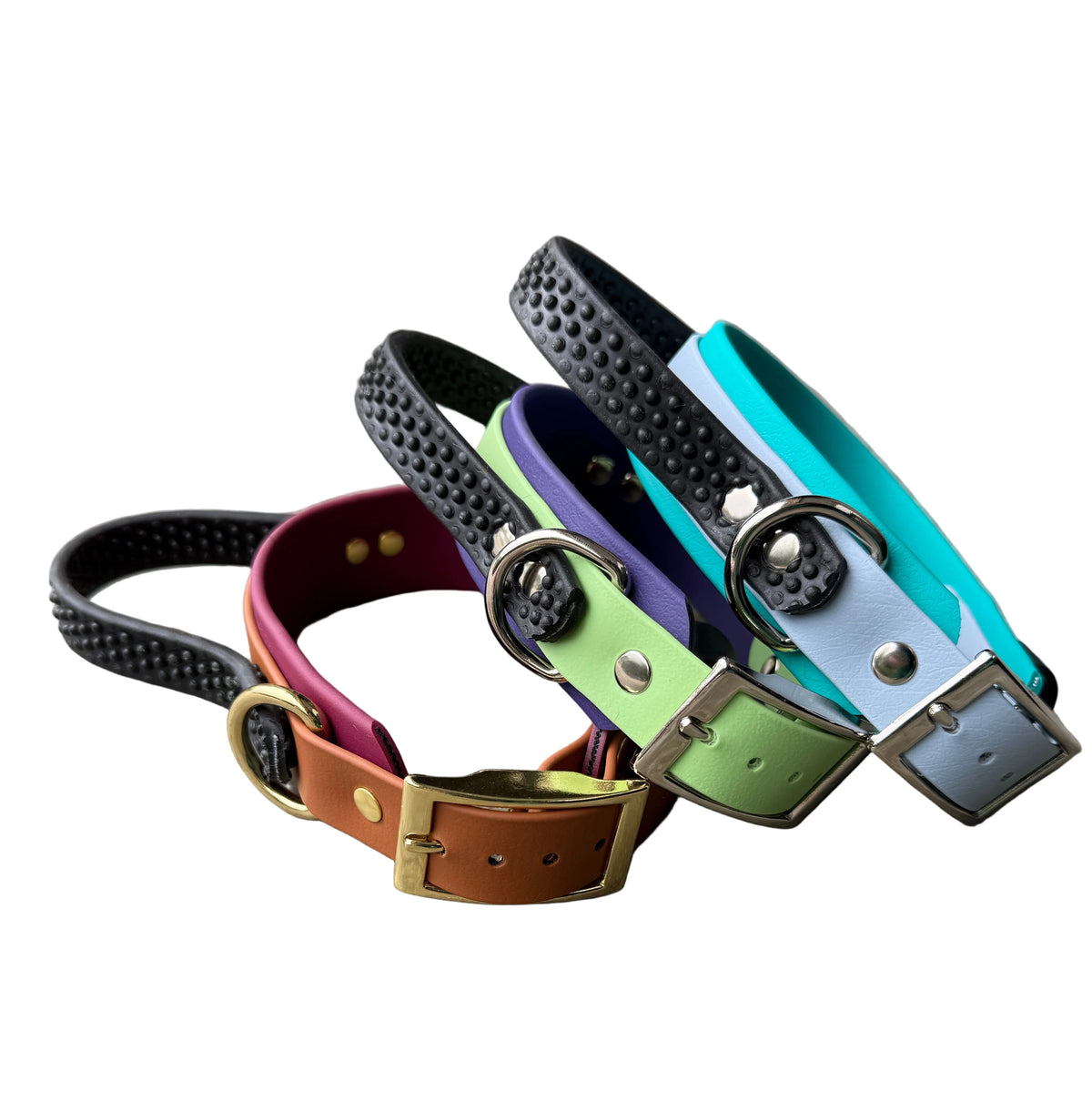 Three colorful dog collars with gold-tone buckles and metal rings. The collars are black, pink, orange, green, purple, blue, and turquoise, with some featuring textured black tops.