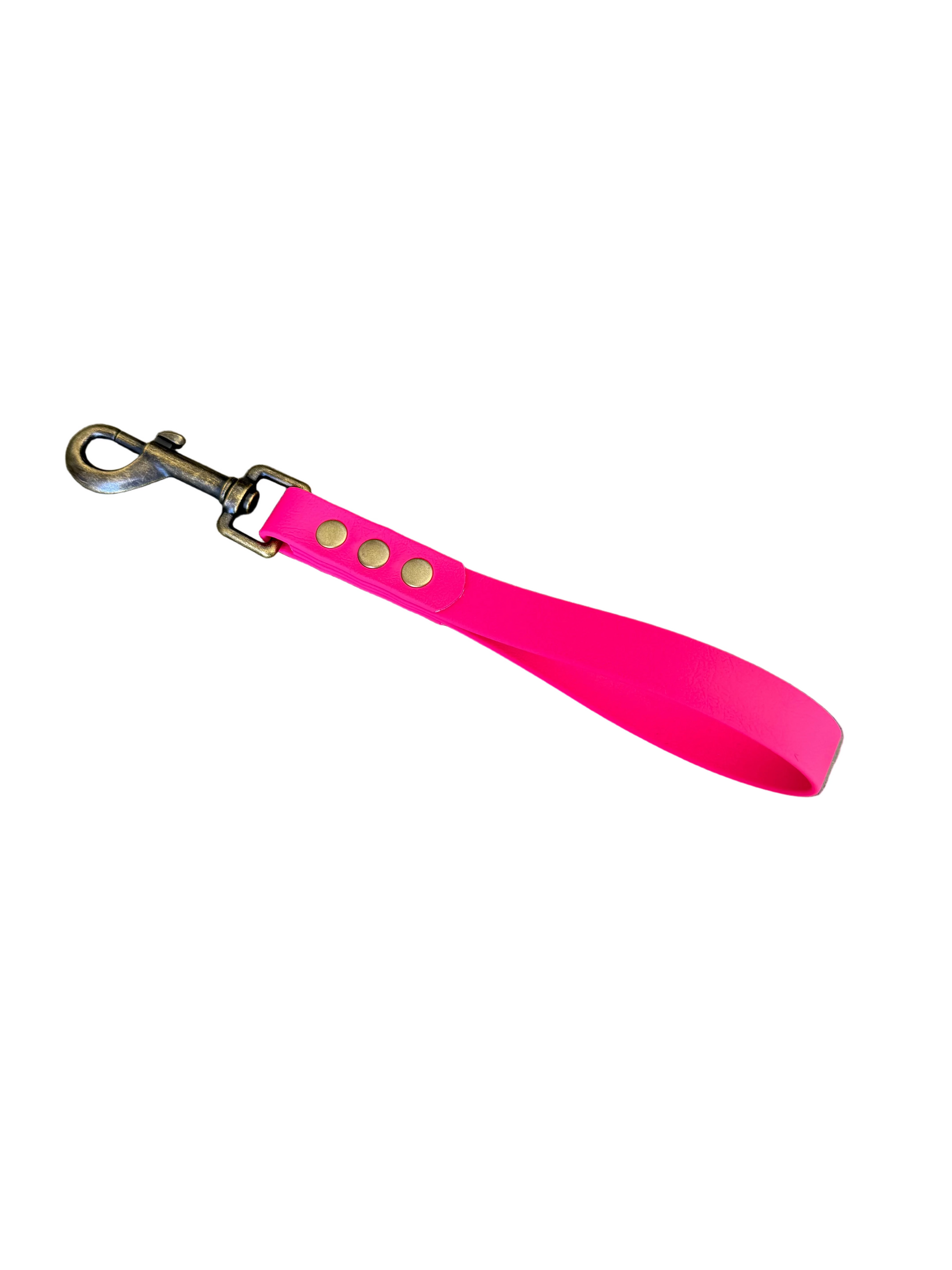 Pink dog leash with brass hardware on a white background.