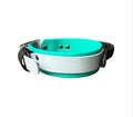 A dog collar with a blue faux-leather body, bright teal accents, and a black strap, 